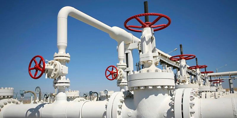 A close up of pipes and valves on an industrial site